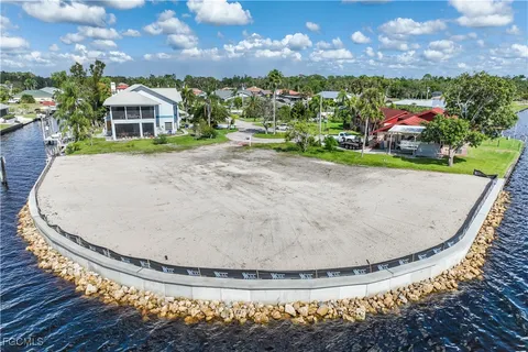 an aerial view of a residential houses with outdoor space