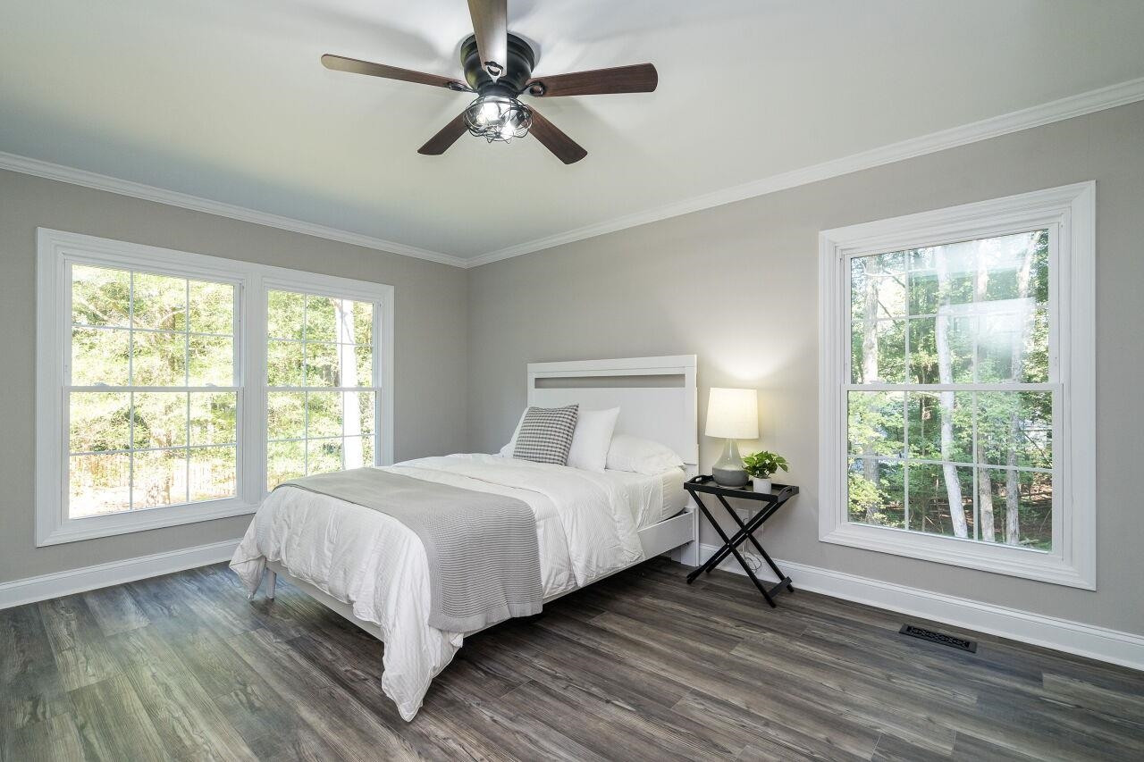 9801 Pine Meadow Lane Raleigh, NC 27615 - Photo 13 of 43 a bedroom with a large bed and a window