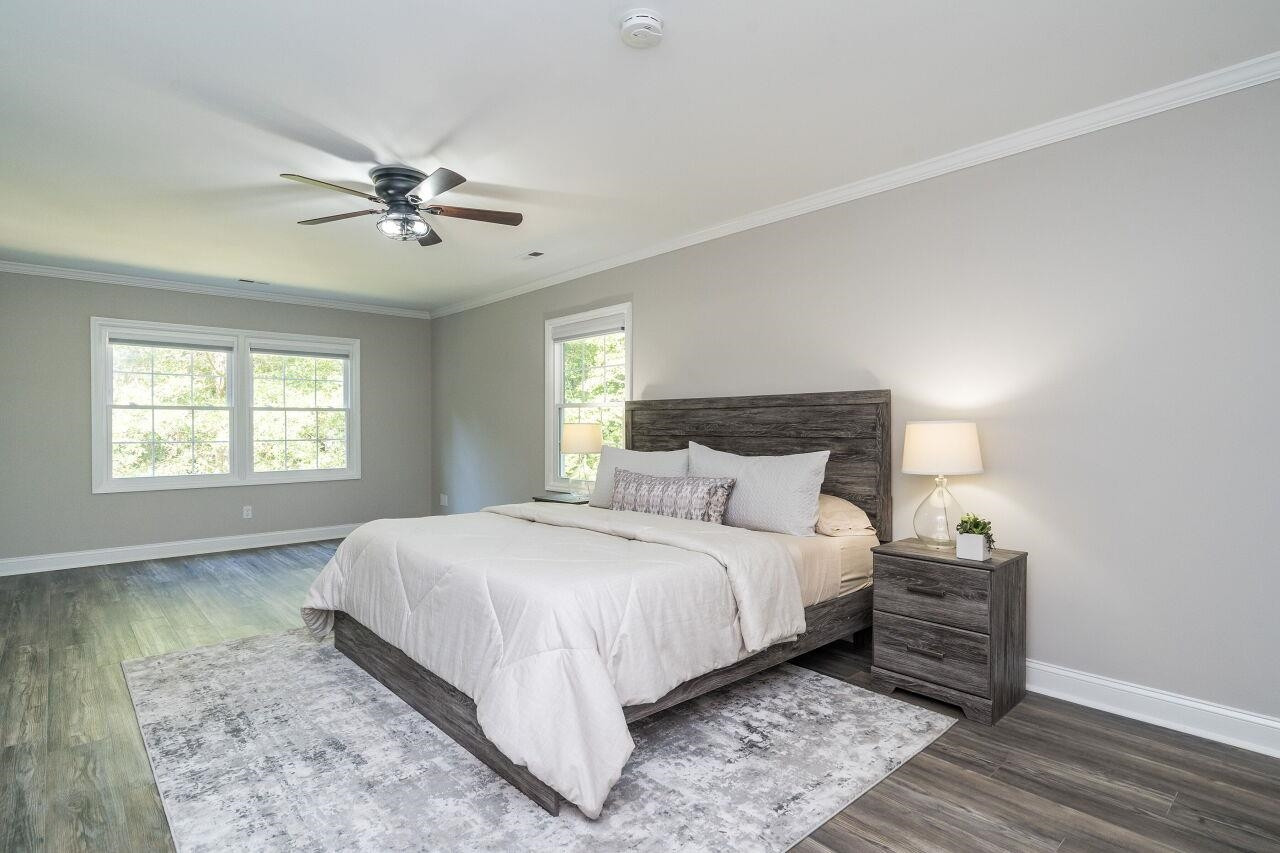 9801 Pine Meadow Lane Raleigh, NC 27615 - Photo 15 of 43 a bedroom with a large bed and a window