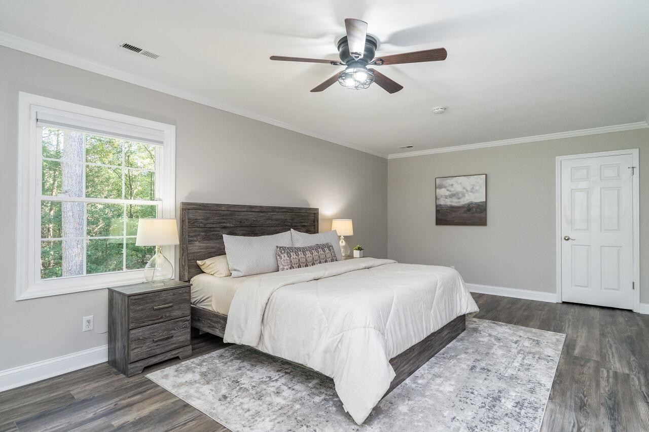 9801 Pine Meadow Lane Raleigh, NC 27615 - Photo 16 of 43 a bedroom with a large bed and a window