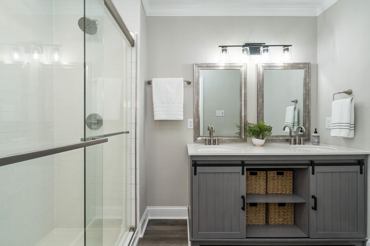 9801 Pine Meadow Lane Raleigh, NC 27615 - Photo 17 of 43 a bathroom with a sink and a mirror