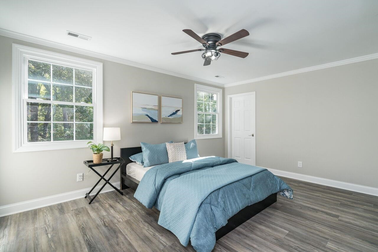 9801 Pine Meadow Lane Raleigh, NC 27615 - Photo 18 of 43 a bedroom with a bed and a window