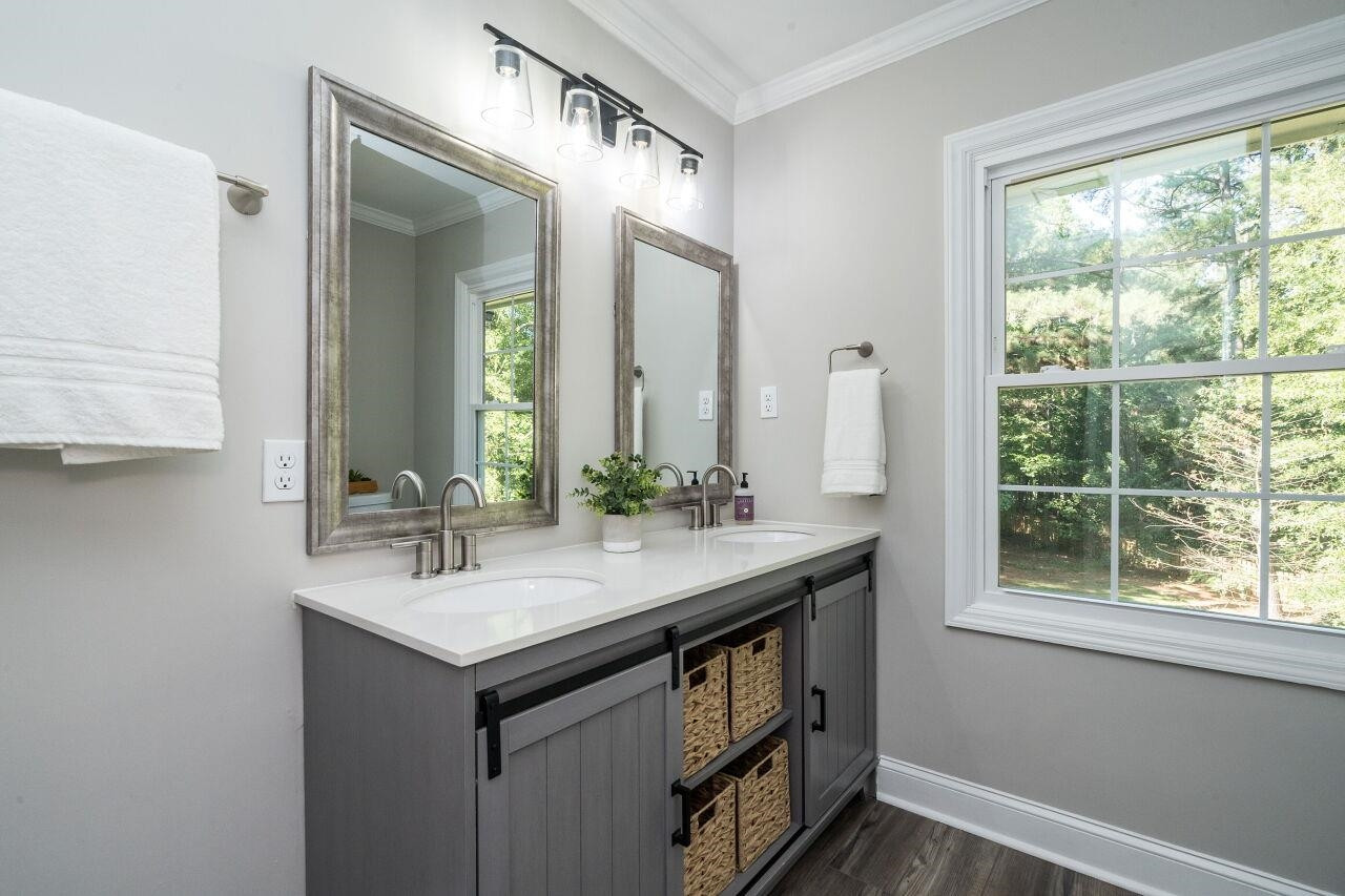9801 Pine Meadow Lane Raleigh, NC 27615 - Photo 20 of 43 a bathroom with a sink and a mirror