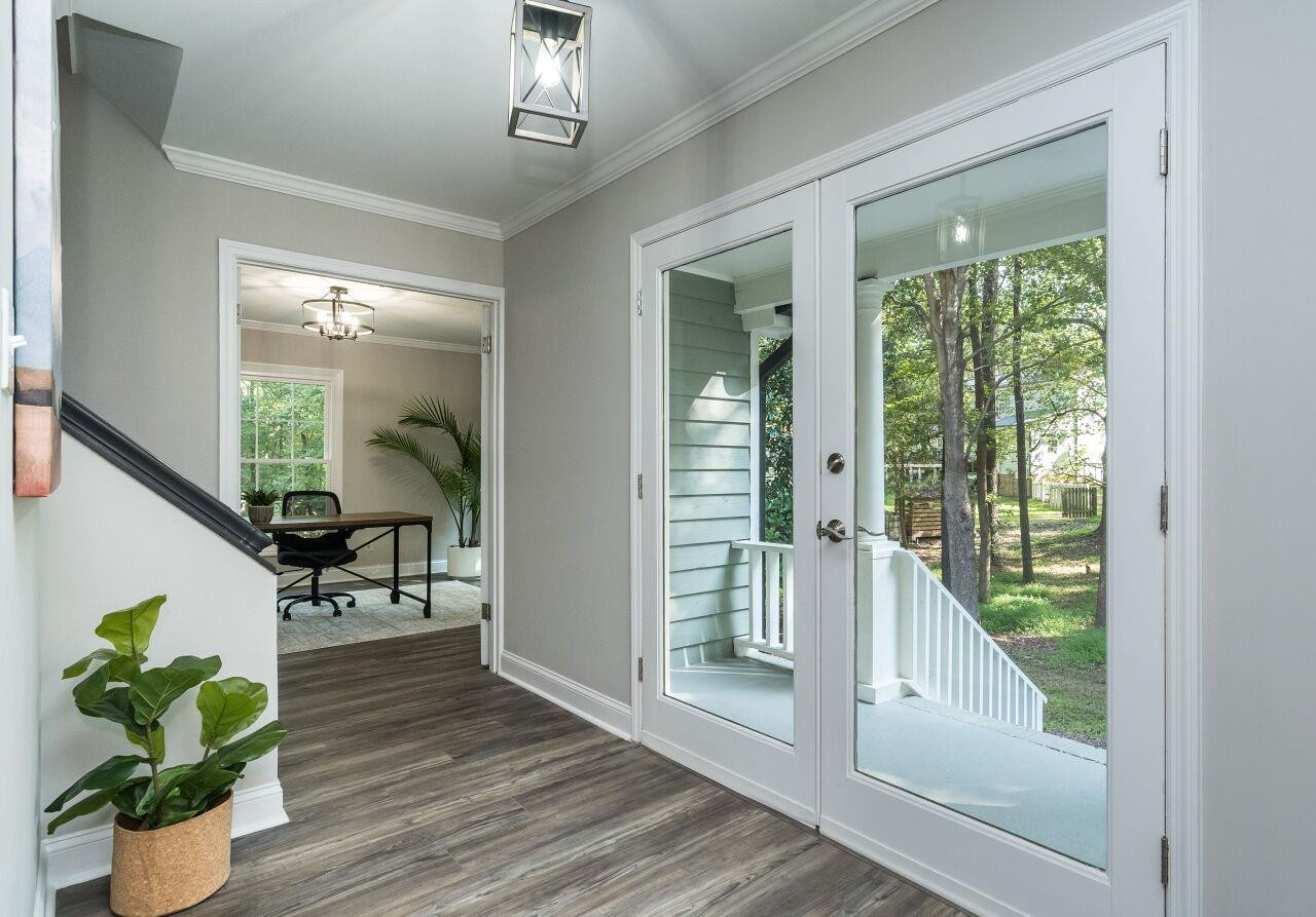 9801 Pine Meadow Lane Raleigh, NC 27615 - Photo 2 of 43 a view of living room filled with furniture and a potted plant