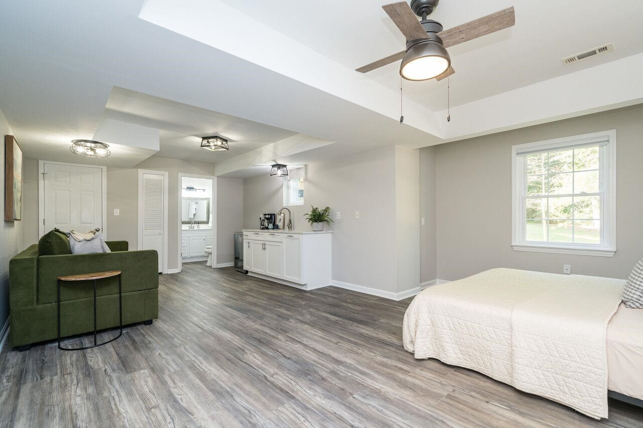 9801 Pine Meadow Lane Raleigh, NC 27615 - Photo 21 of 43 a spacious bedroom with a bed and furniture