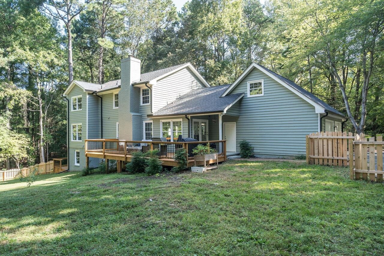 9801 Pine Meadow Lane Raleigh, NC 27615 - Photo 28 of 43 a view of a house with a yard and sitting area