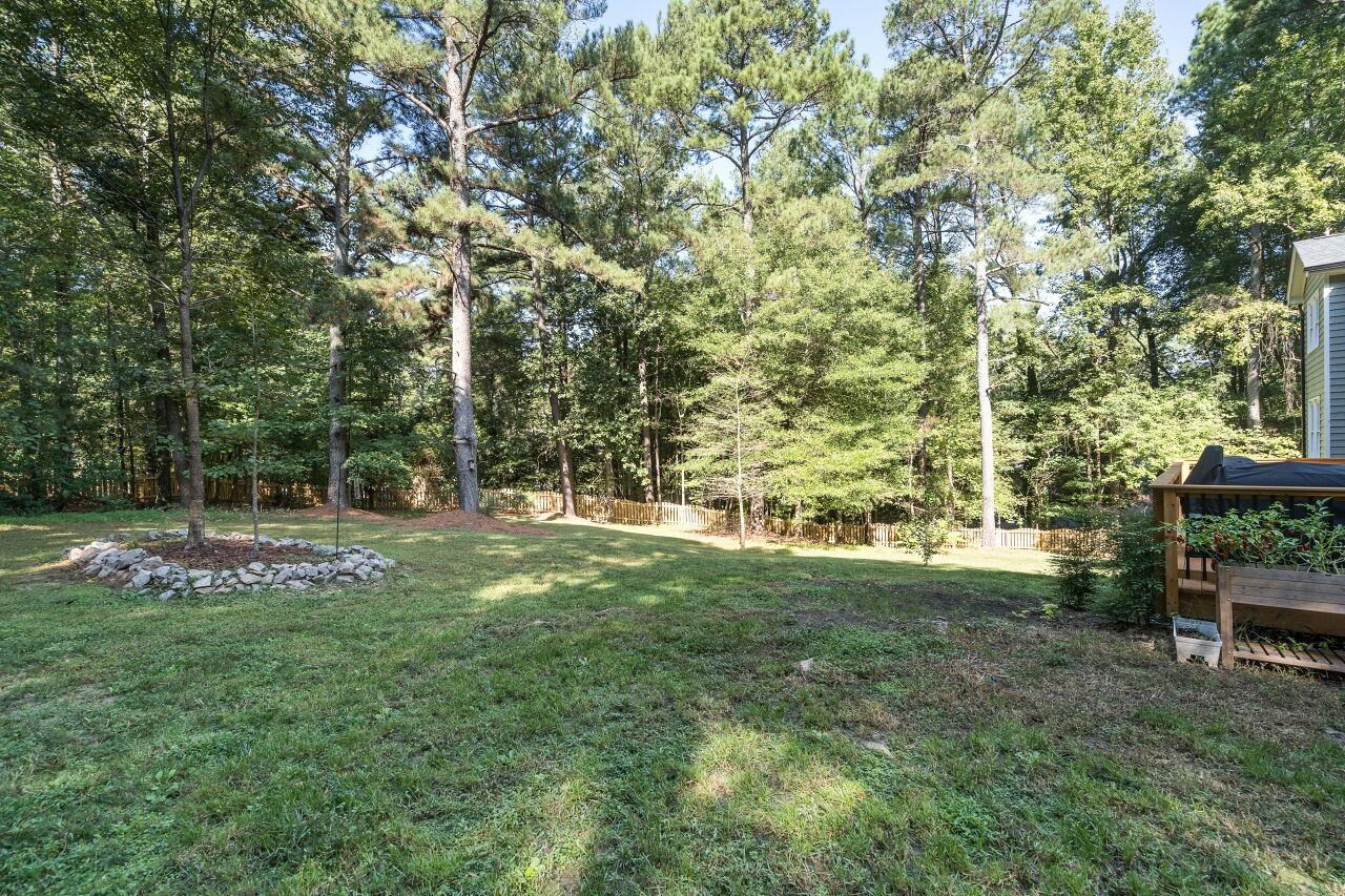 9801 Pine Meadow Lane Raleigh, NC 27615 - Photo 30 of 43 a view of a park with large trees