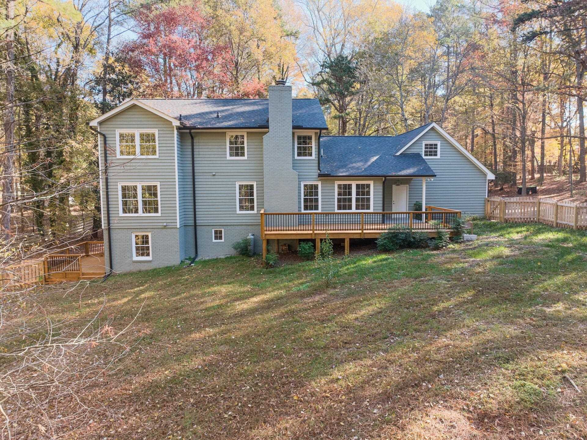 9801 Pine Meadow Lane Raleigh, NC 27615 - Photo 31 of 43 a front view of a house with a yard