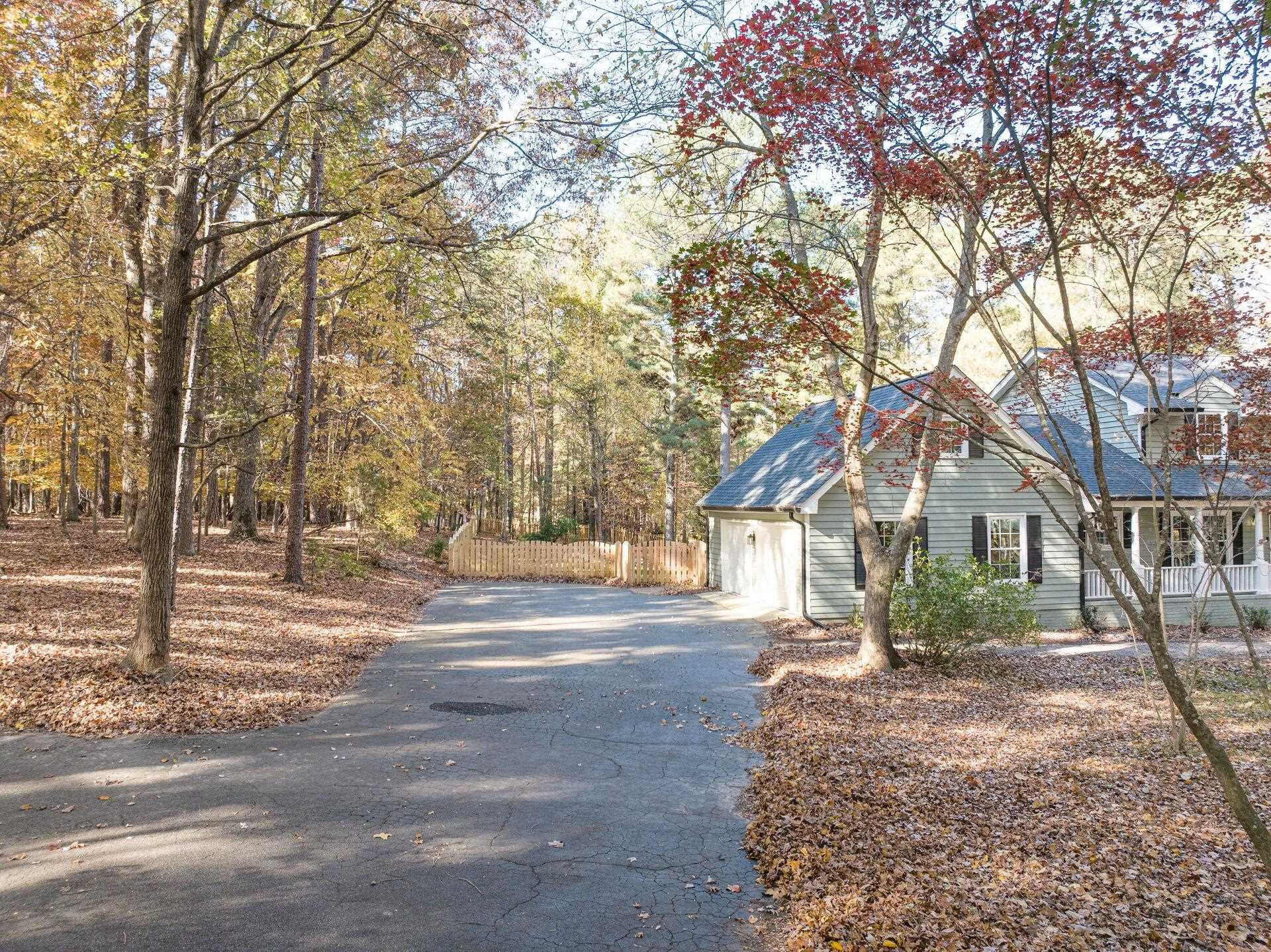 9801 Pine Meadow Lane Raleigh, NC 27615 - Photo 34 of 43 a tree in the middle of a yard