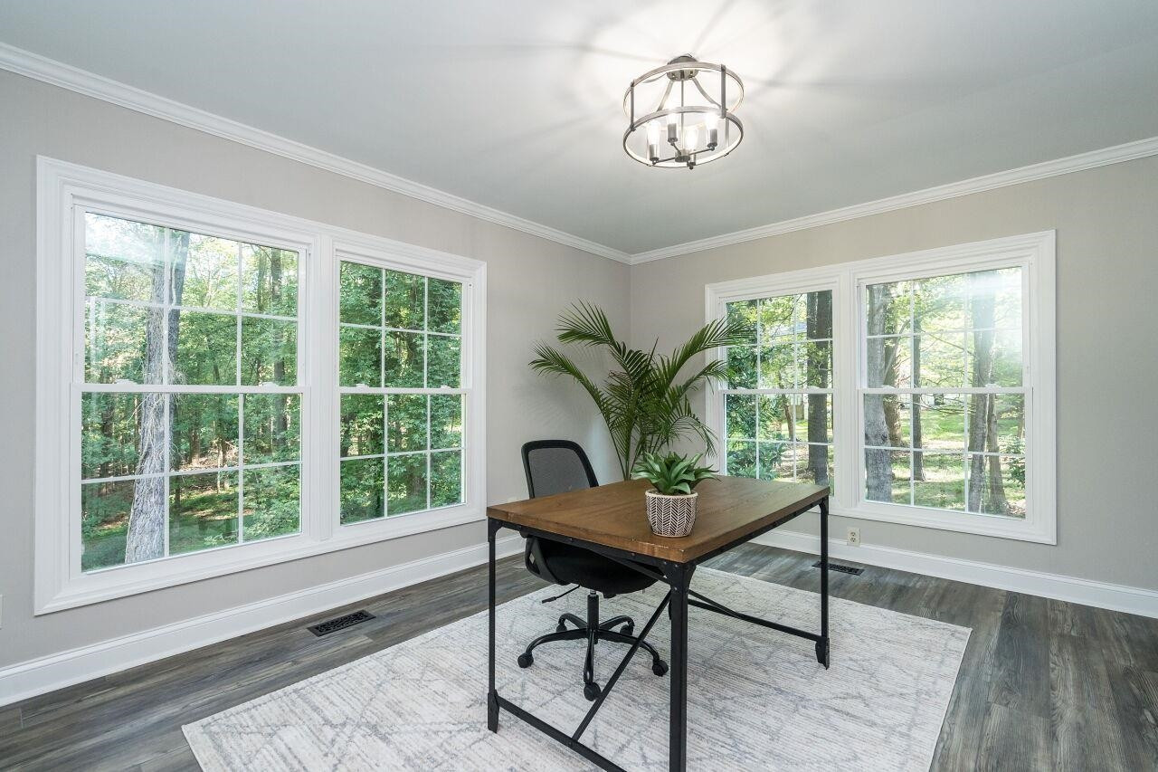 9801 Pine Meadow Lane Raleigh, NC 27615 - Photo 4 of 43 a workspace room with furniture window and wooden floor