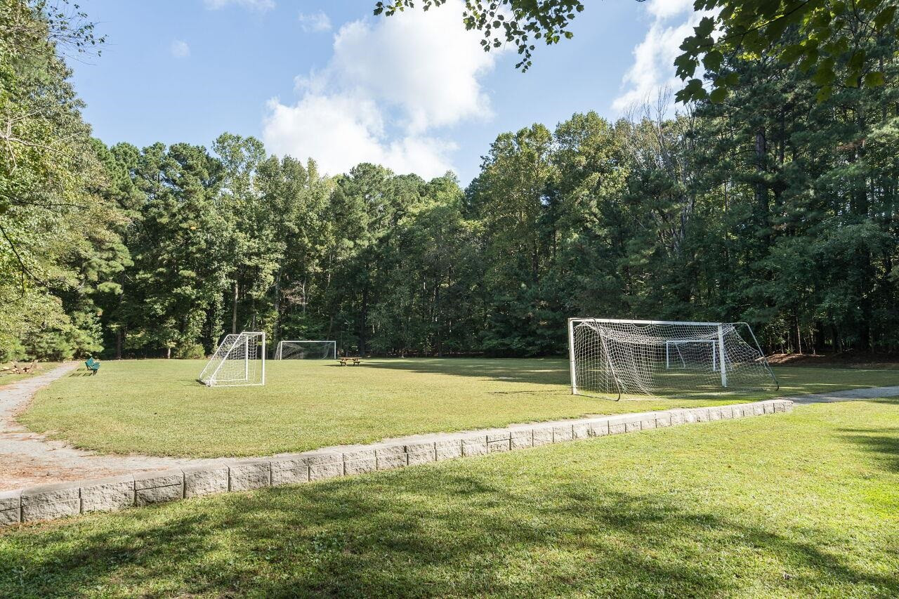 9801 Pine Meadow Lane Raleigh, NC 27615 - Photo 43 of 43 a view of a swimming pool with a yard