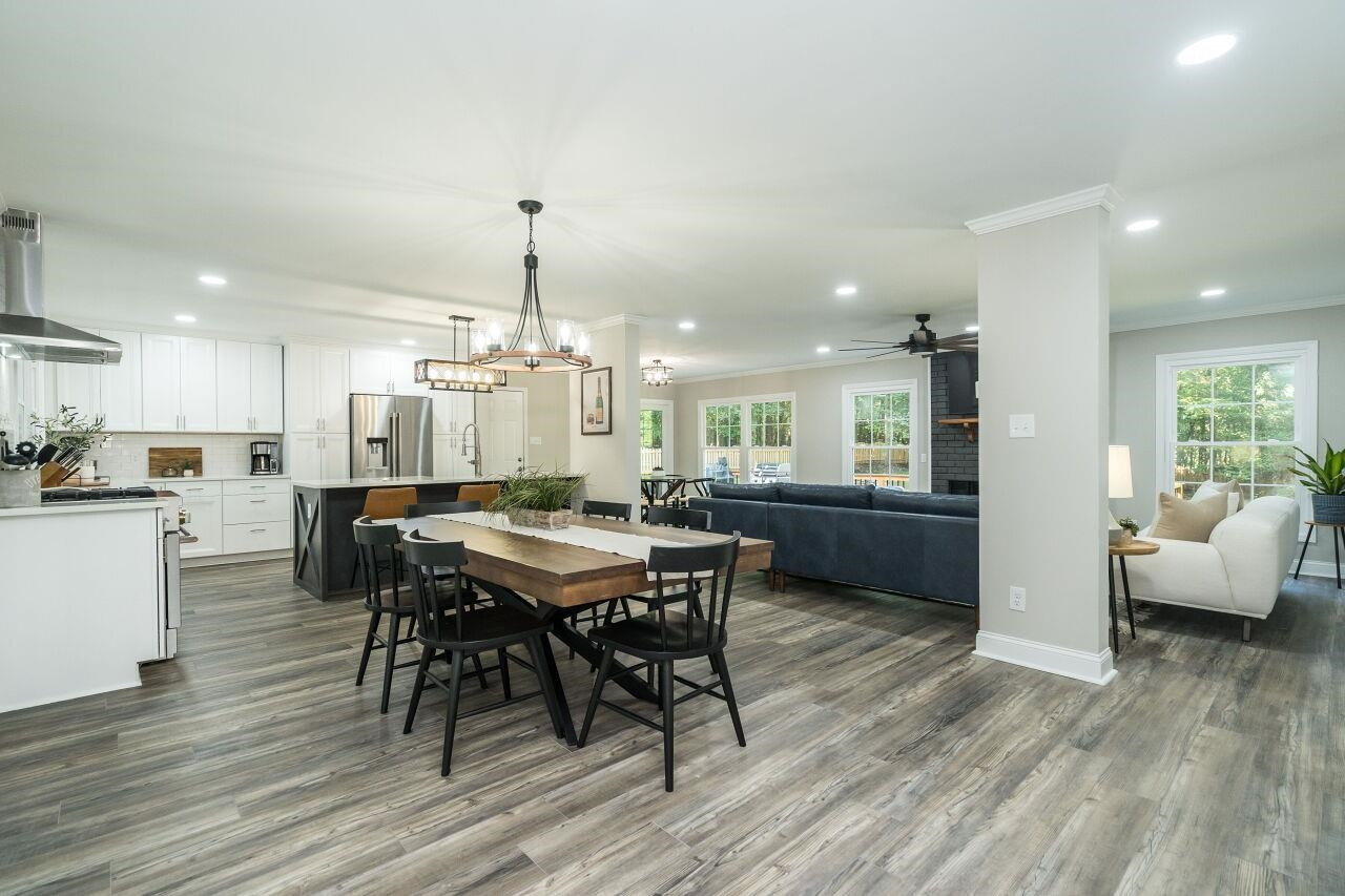 9801 Pine Meadow Lane Raleigh, NC 27615 - Photo 5 of 43 a view of a dining room with furniture and wooden floor