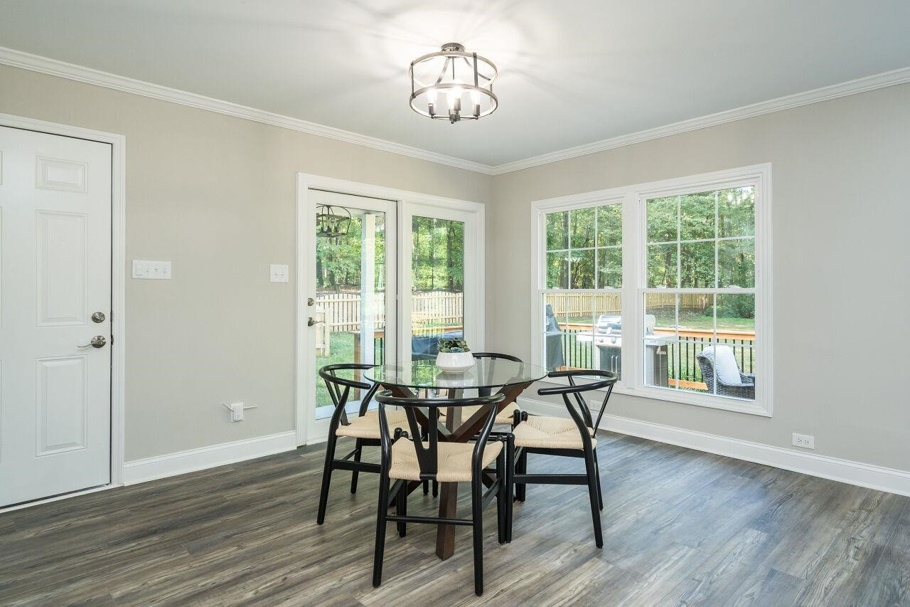 9801 Pine Meadow Lane Raleigh, NC 27615 - Photo 10 of 43 a view of a dining room with furniture window and outside view