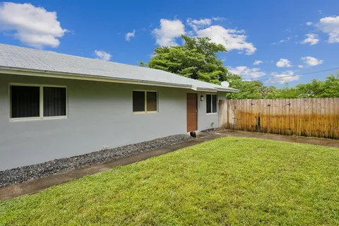 a backyard of a house with lots of green space