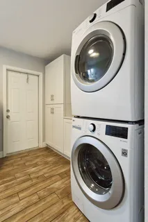 a view of a hallway with washer and dryer