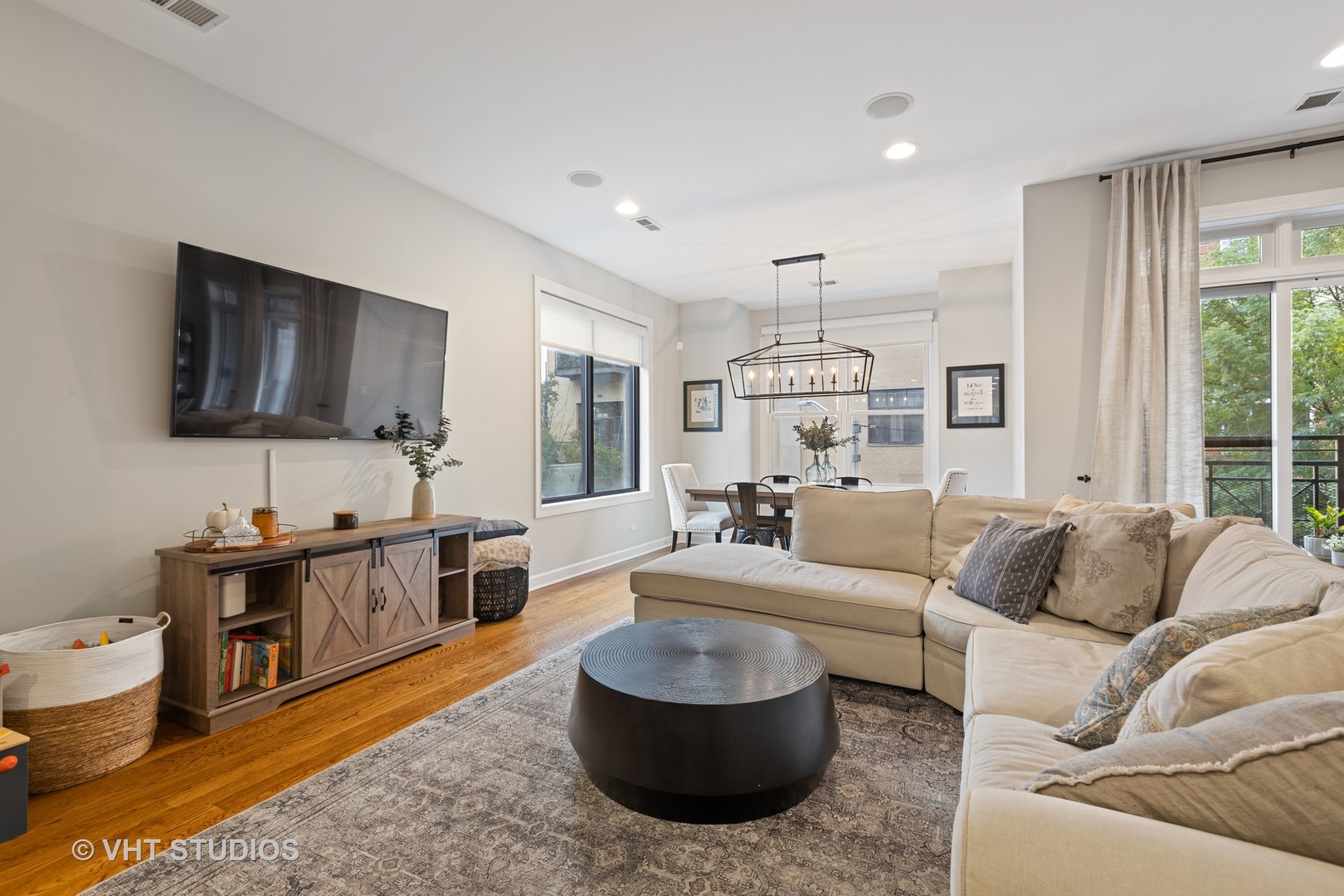 2112 West Rice Street, Unit 2 Chicago, IL 60622 - Photo 2 of 16 a living room with furniture and a flat screen tv