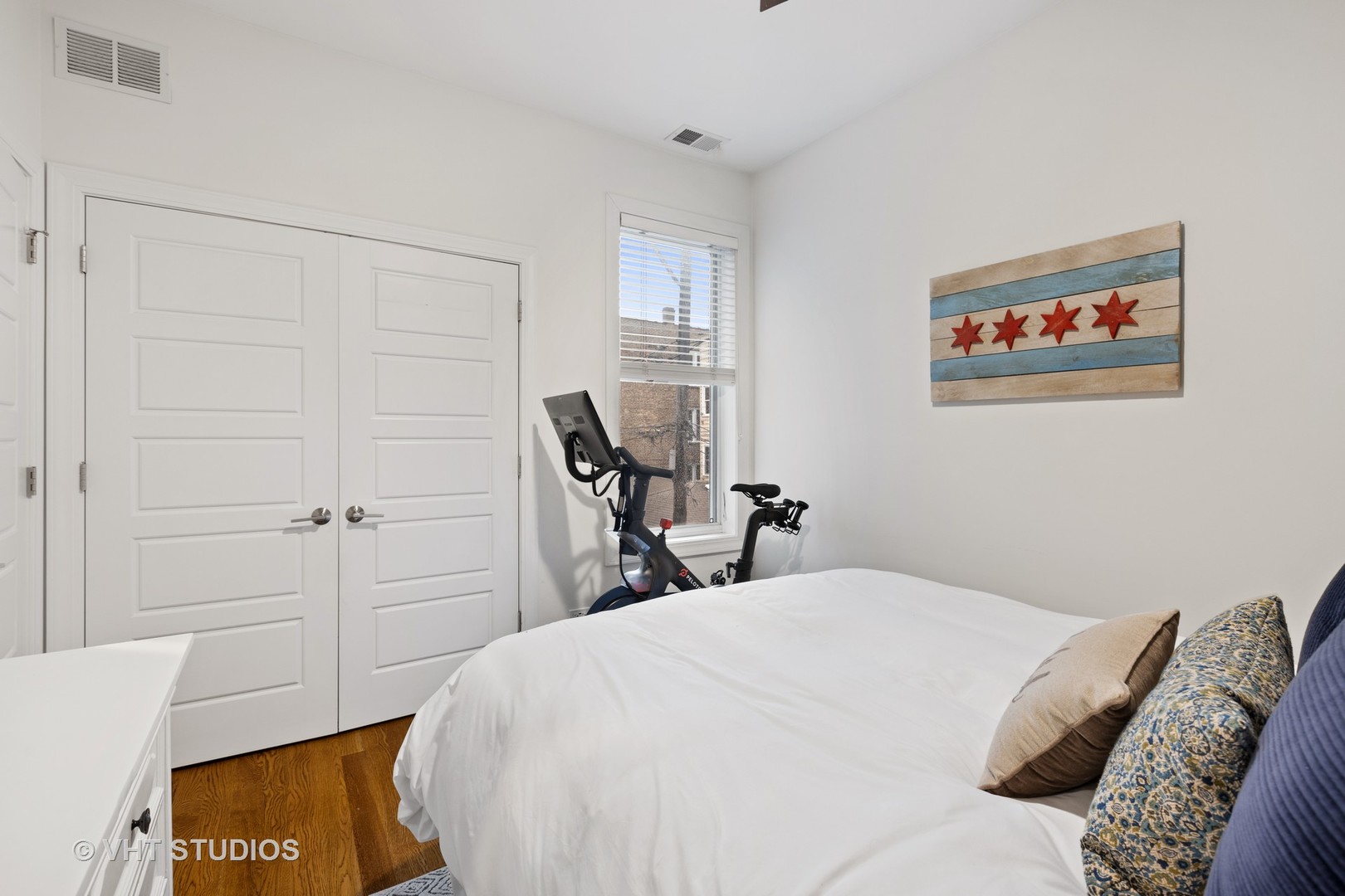 2112 West Rice Street, Unit 2 Chicago, IL 60622 - Photo 11 of 16 a bedroom with a bed and a table