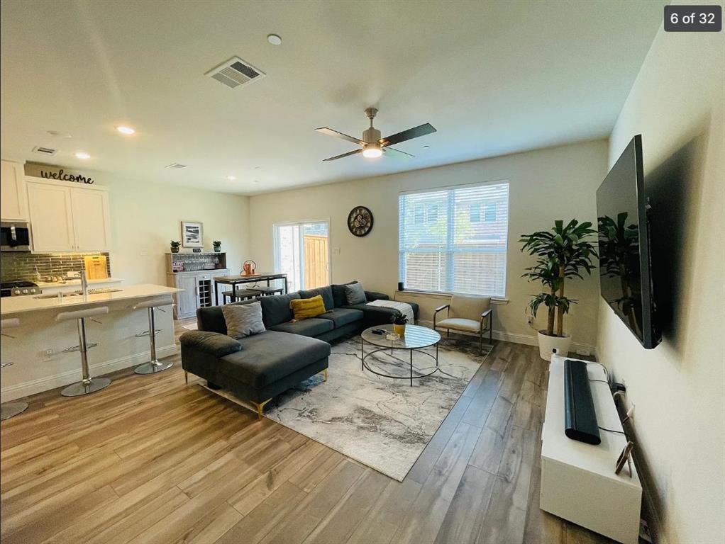 1009 Emil Place Allen, TX 75013 - Photo 1 of 31 a living room with furniture kitchen view and a large window