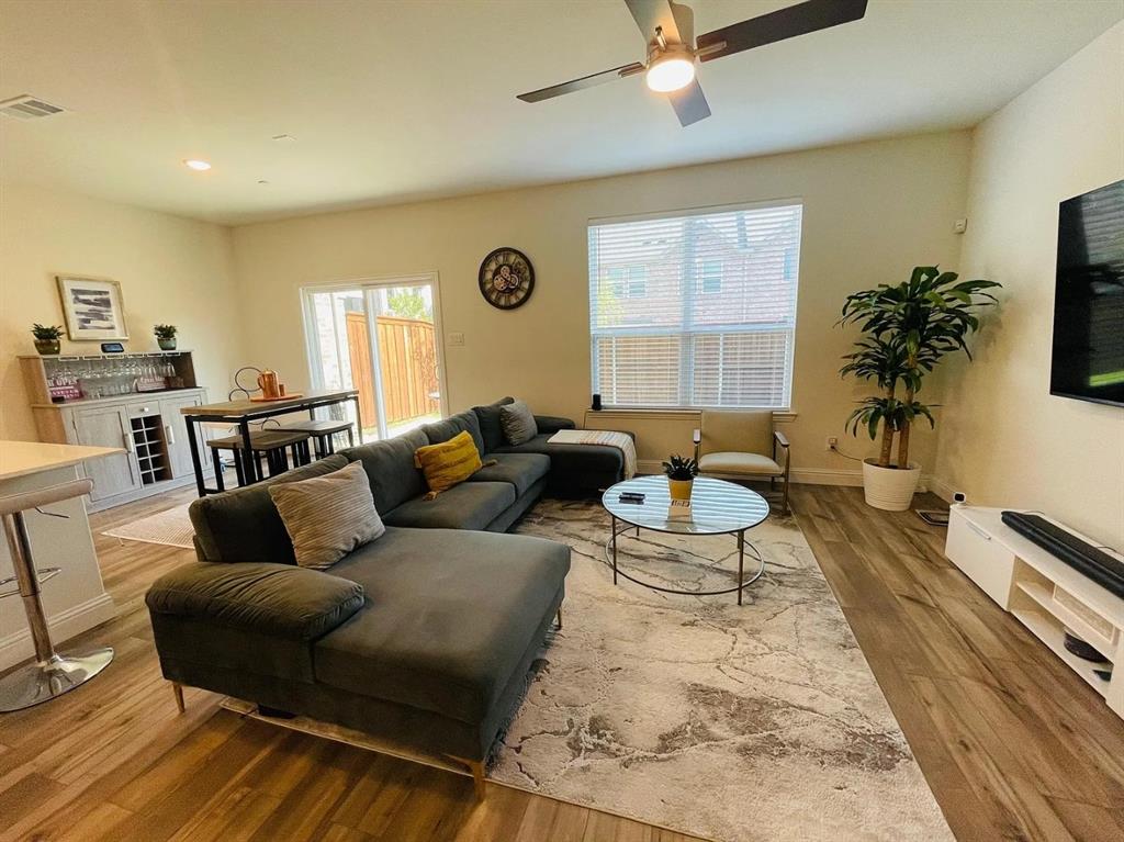 1009 Emil Place Allen, TX 75013 - Photo 2 of 31 a living room with furniture and a large window