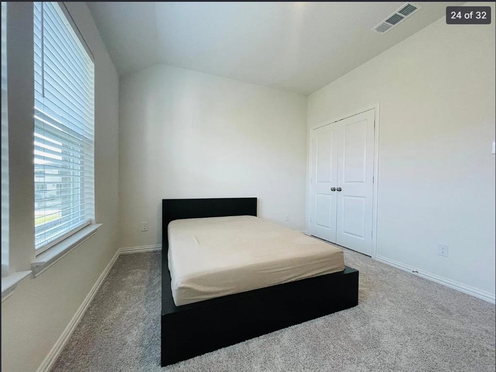 1009 Emil Place Allen, TX 75013 - Photo 23 of 31 a room with a bed and a window