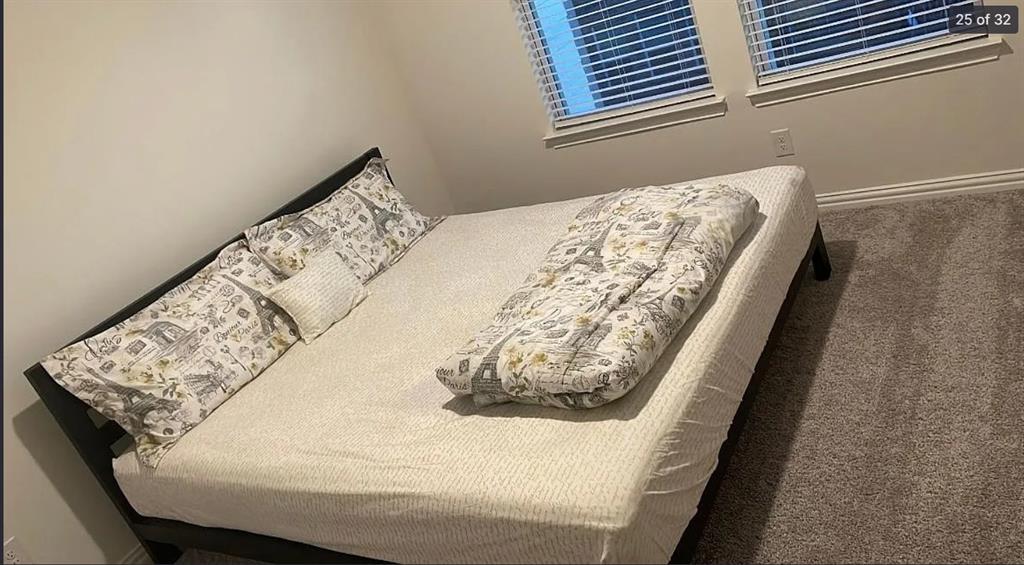 1009 Emil Place Allen, TX 75013 - Photo 24 of 31 a bed sitting in a bedroom next to a window
