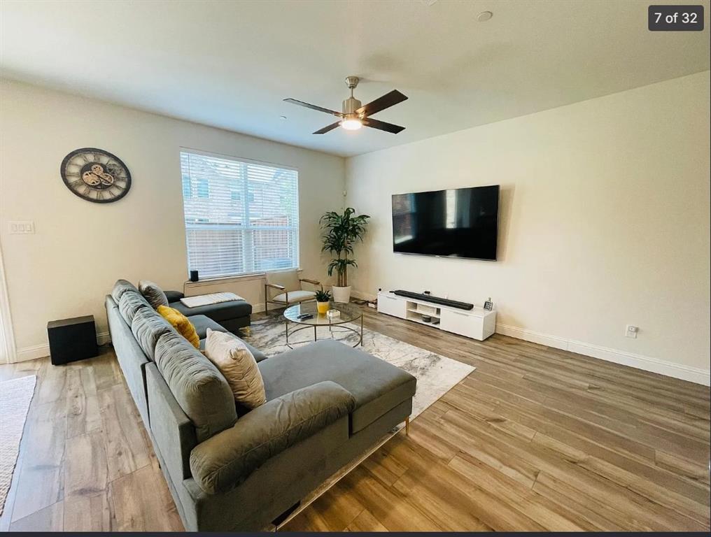1009 Emil Place Allen, TX 75013 - Photo 7 of 31 a living room with furniture and a flat screen tv