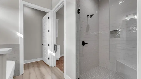 a bathroom with a granite countertop shower