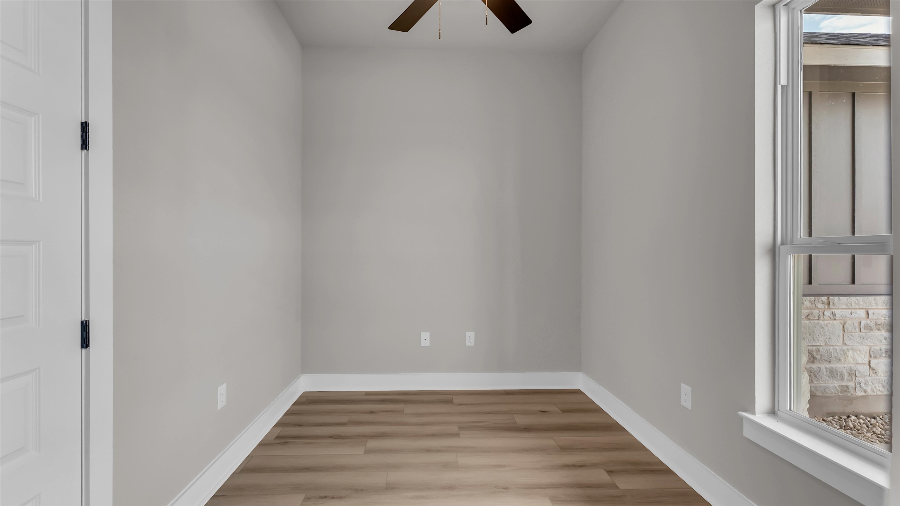 373 Prarie Point Road Bertram, TX 78605 - Photo 23 of 25 a view of an empty room with wooden floor and a window