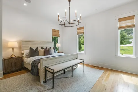 a bedroom with bed and a window