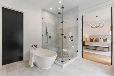 a bathroom with a bathtub and a shower