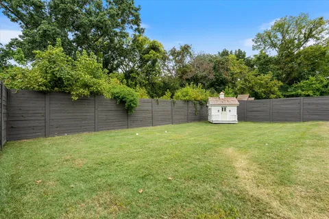 a backyard of a house with lots of green space
