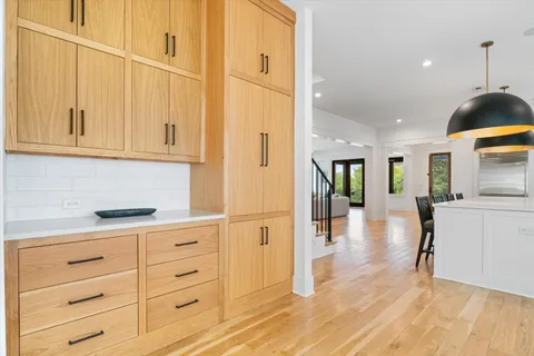 a kitchen with stainless steel appliances granite countertop a refrigerator and cabinets