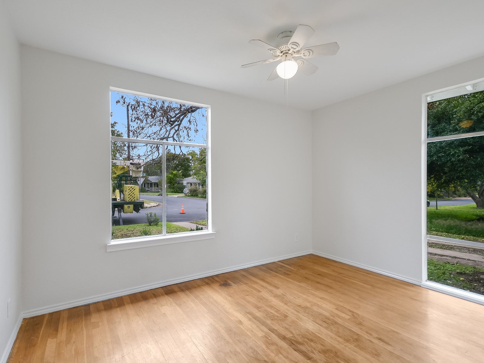 112 East Skyview Road Austin, TX 78752 - Photo 6 of 10 wooden floor in an empty room with a window