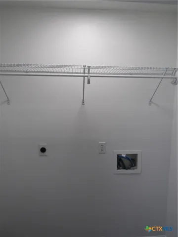 a view of a room with racks on the wall