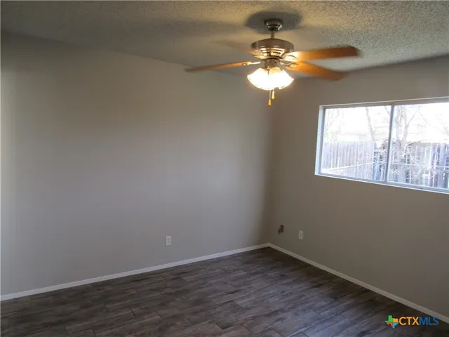 a view of a windows and chandelier fan in a room