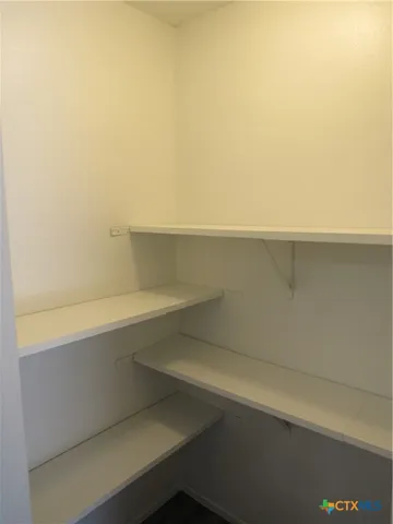 a view of small space with racks on the wall