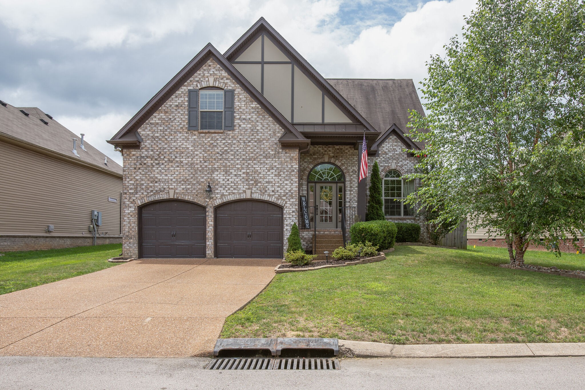 1073 Golf View Way Spring Hill, TN 37174 - Photo 1 of 34 a front view of a house with garden