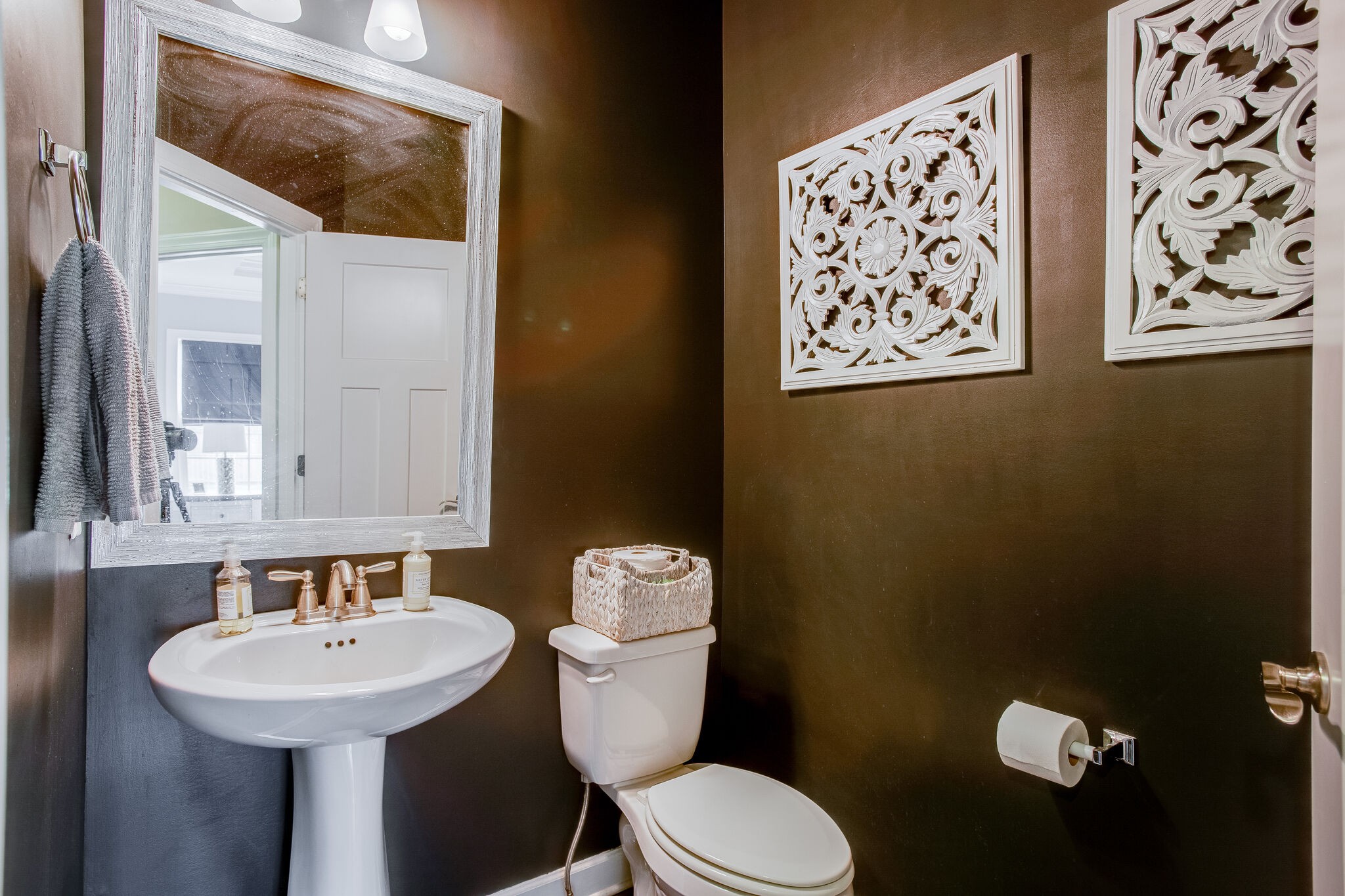 1073 Golf View Way Spring Hill, TN 37174 - Photo 18 of 34 a bathroom with a toilet sink and mirror