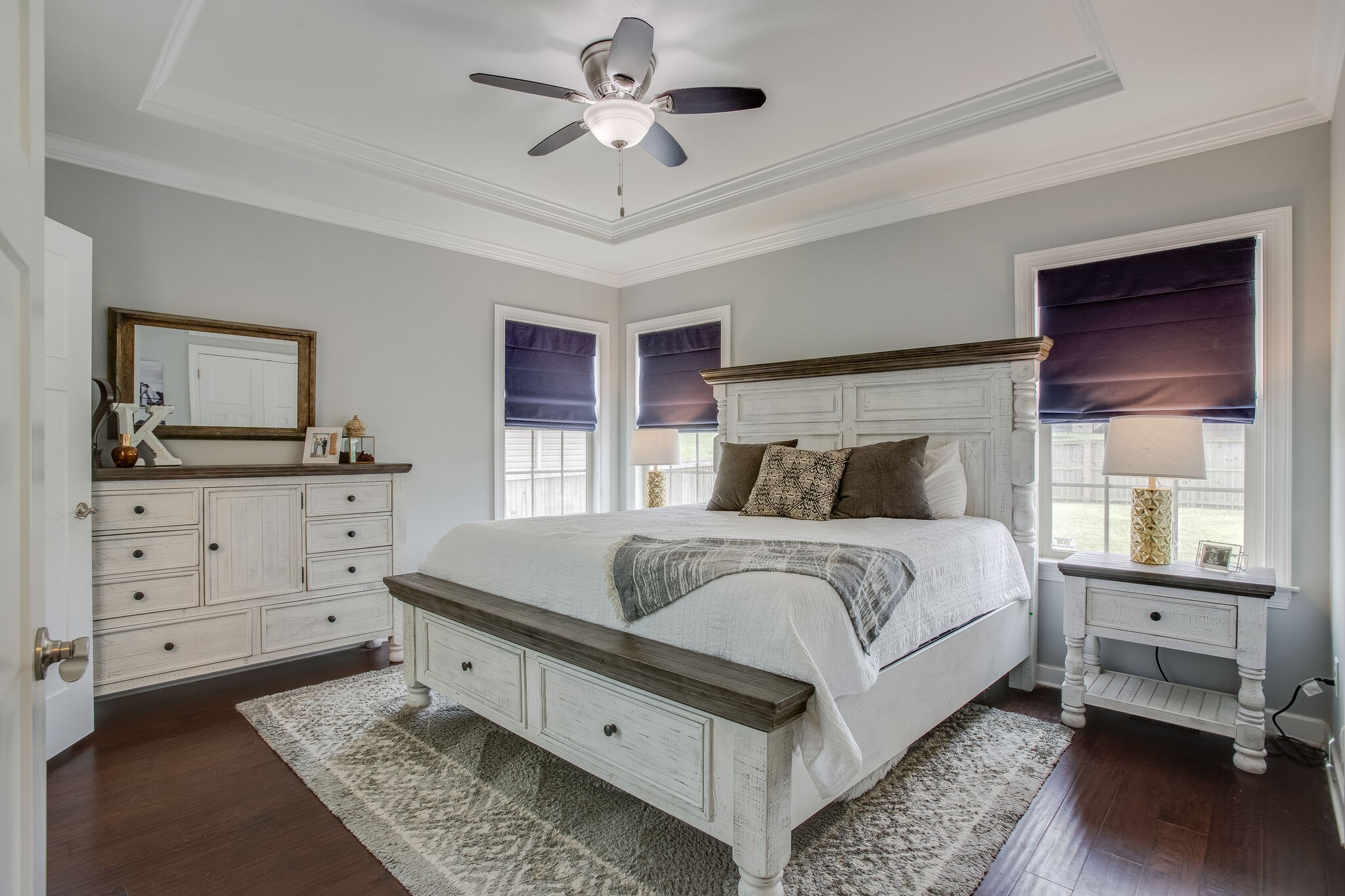 1073 Golf View Way Spring Hill, TN 37174 - Photo 19 of 34 a bedroom with a bed and a dresser