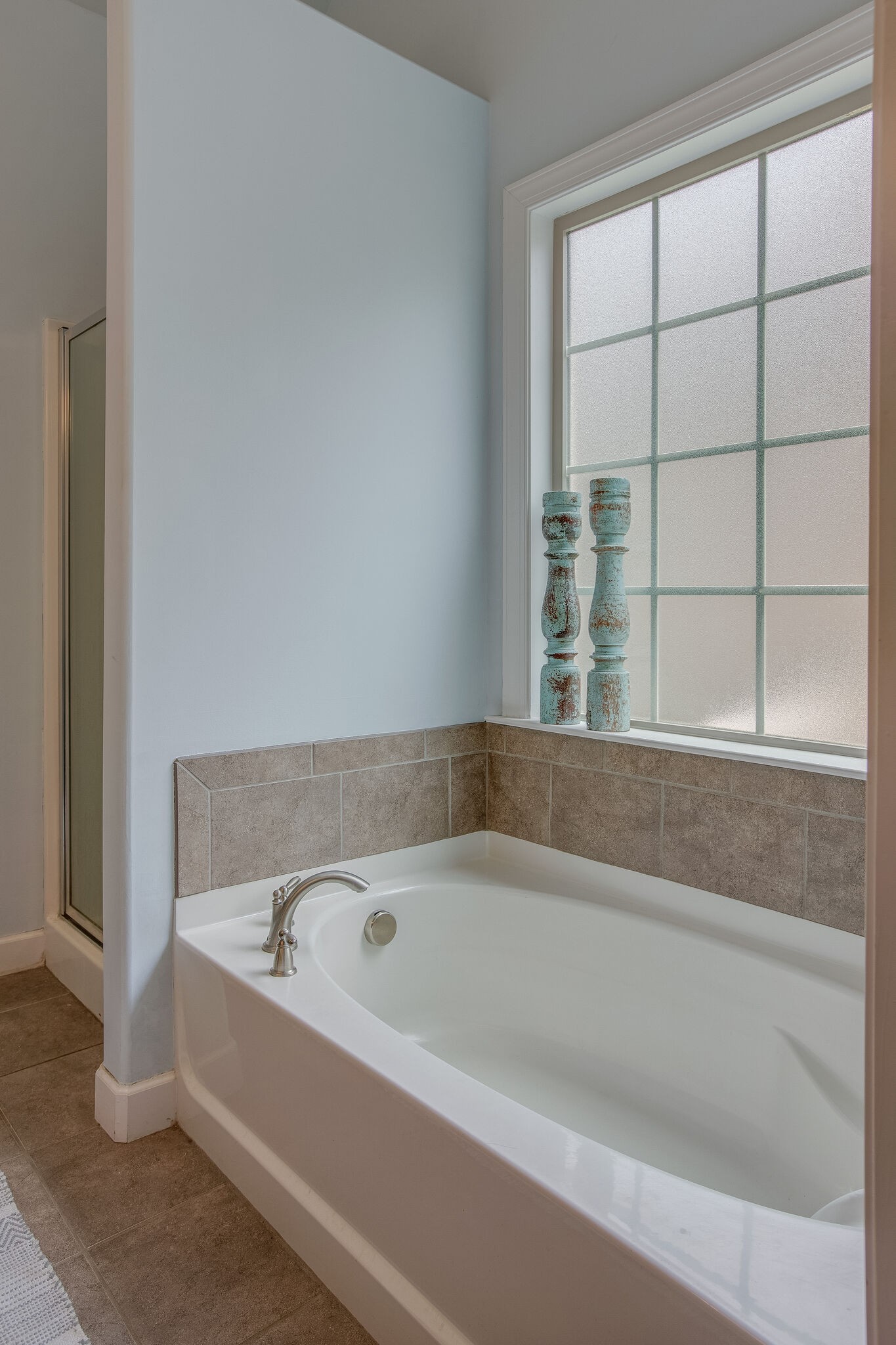 1073 Golf View Way Spring Hill, TN 37174 - Photo 22 of 34 a white bath tub sitting next to a window