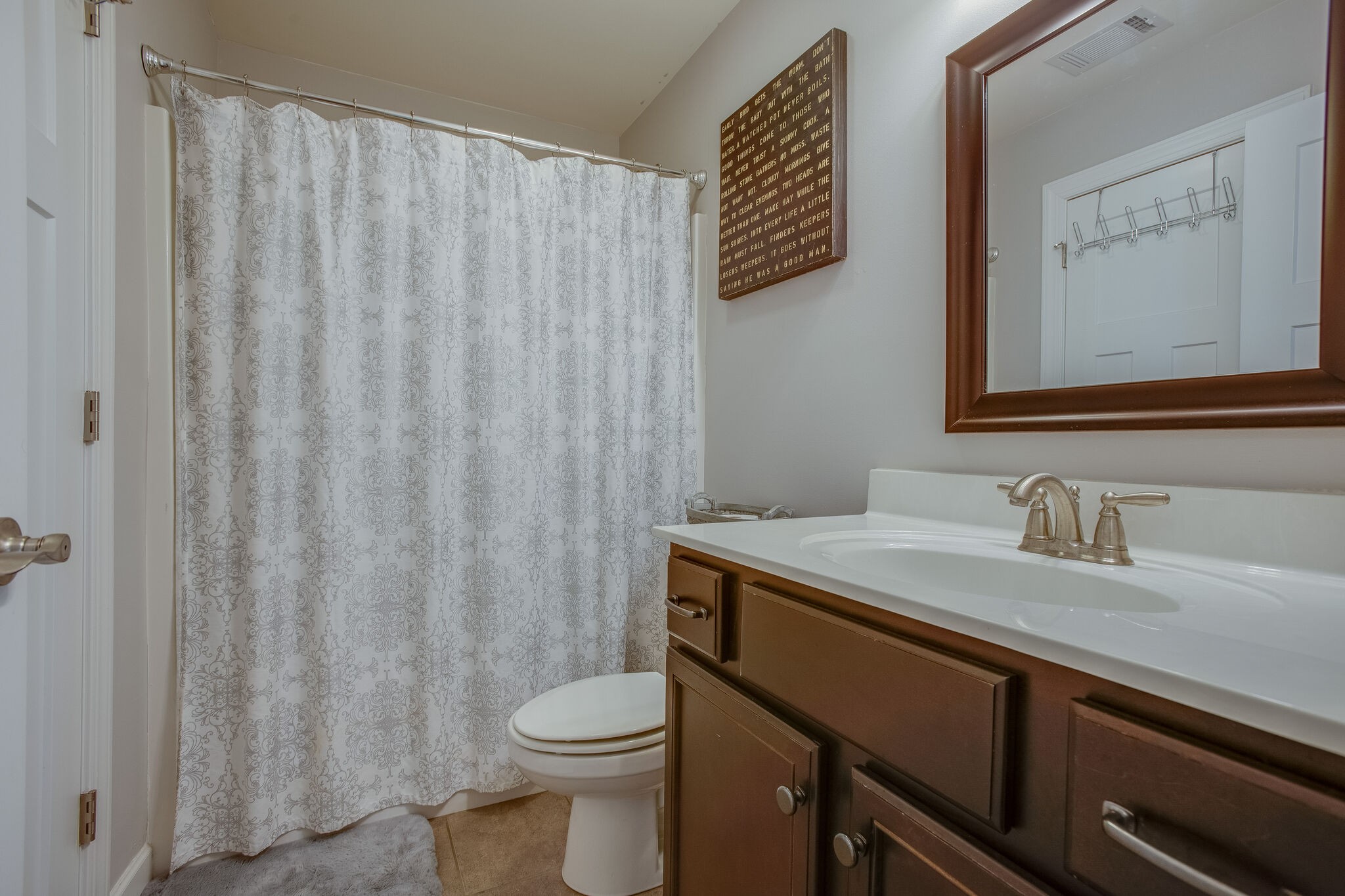 1073 Golf View Way Spring Hill, TN 37174 - Photo 26 of 34 a bathroom with a granite countertop sink vanity mirror and toilet