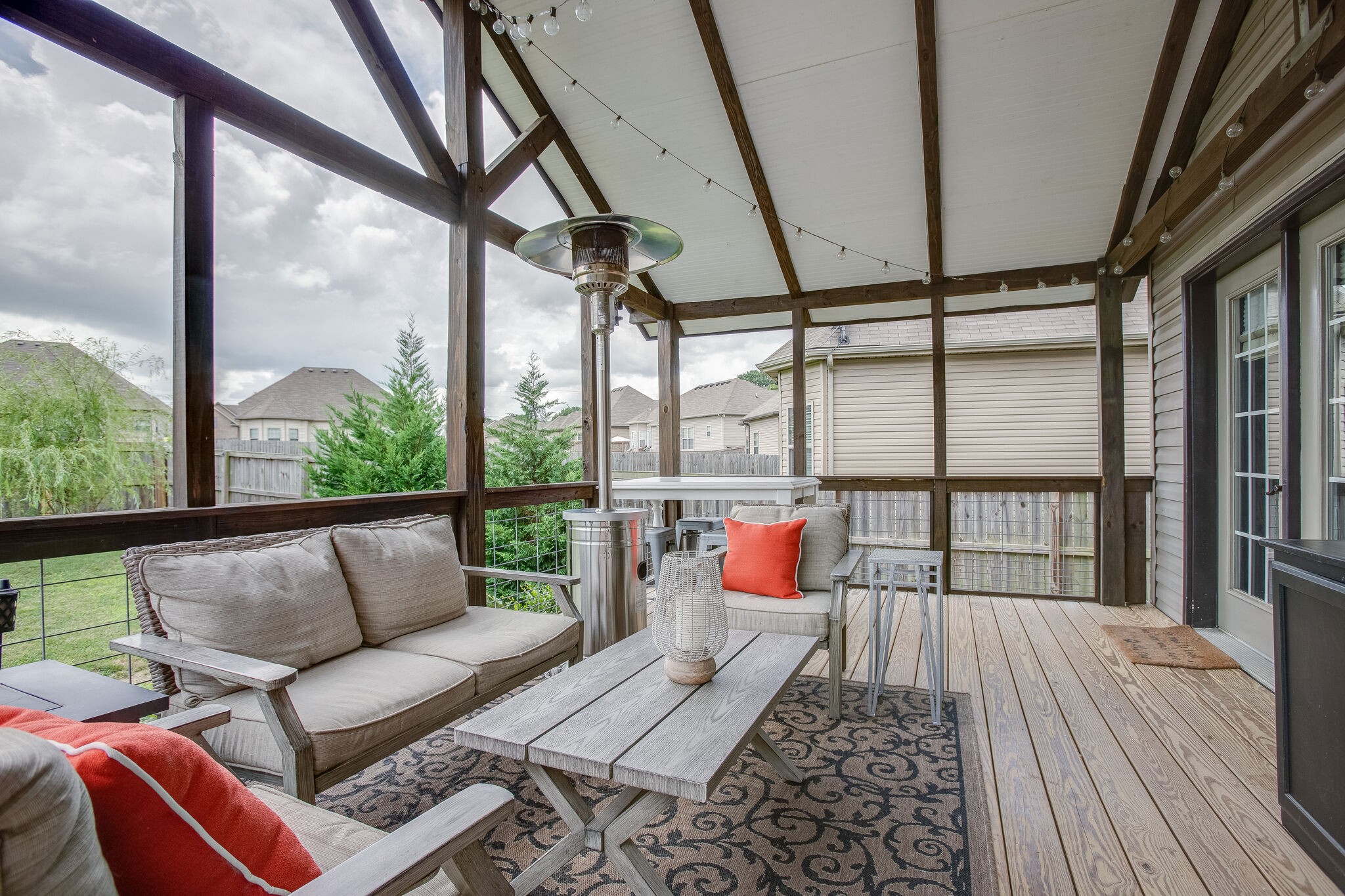 1073 Golf View Way Spring Hill, TN 37174 - Photo 30 of 34 a balcony view with a couch and wooden floor