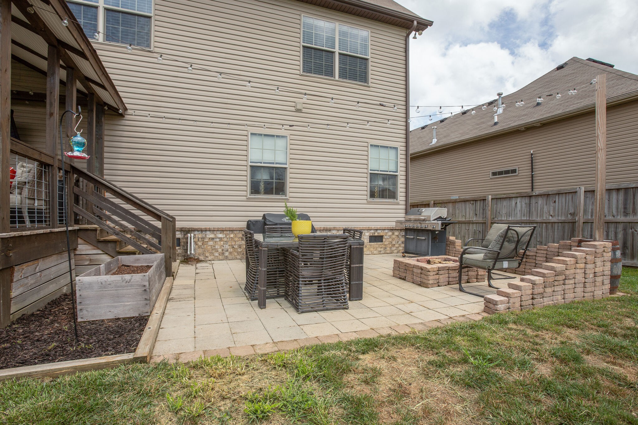 1073 Golf View Way Spring Hill, TN 37174 - Photo 32 of 34 a view of a chairs and table in backyard