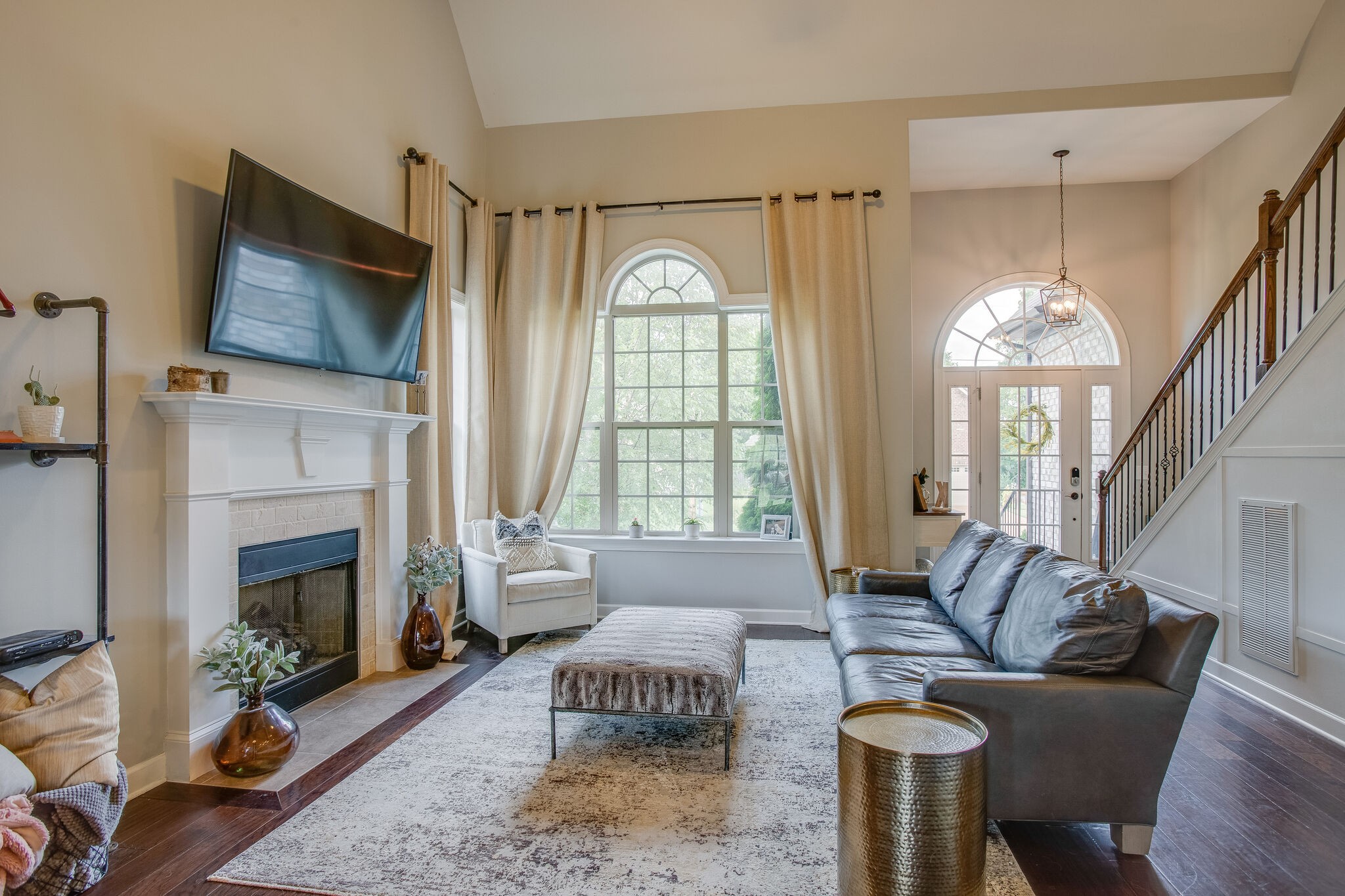1073 Golf View Way Spring Hill, TN 37174 - Photo 8 of 34 a living room with furniture a fireplace and a flat screen tv