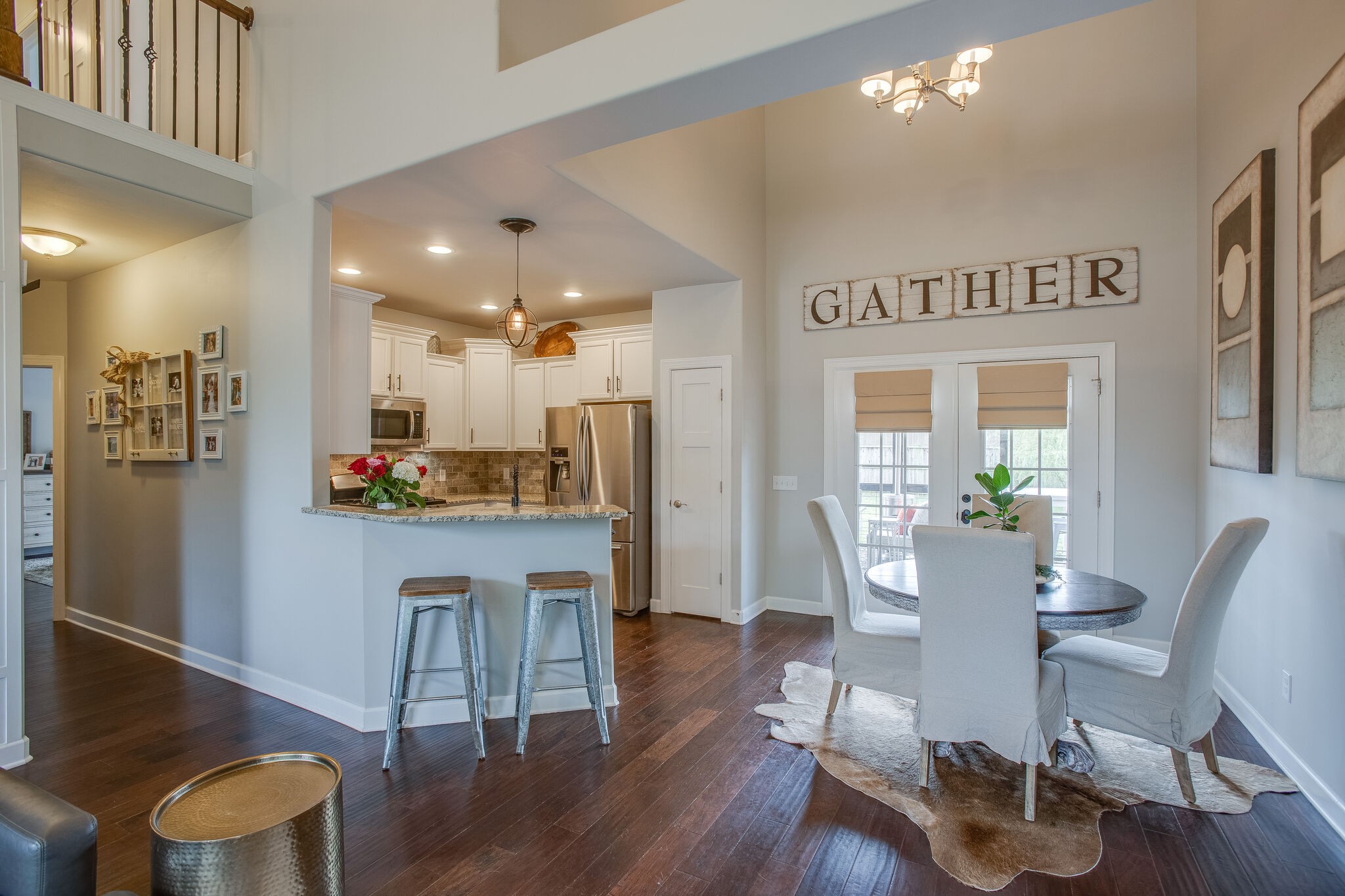 1073 Golf View Way Spring Hill, TN 37174 - Photo 10 of 34 a view of a dining room with furniture and wooden floor
