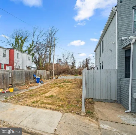 a view of a backyard of the house