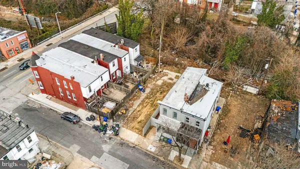 a view of a backyard with a tree