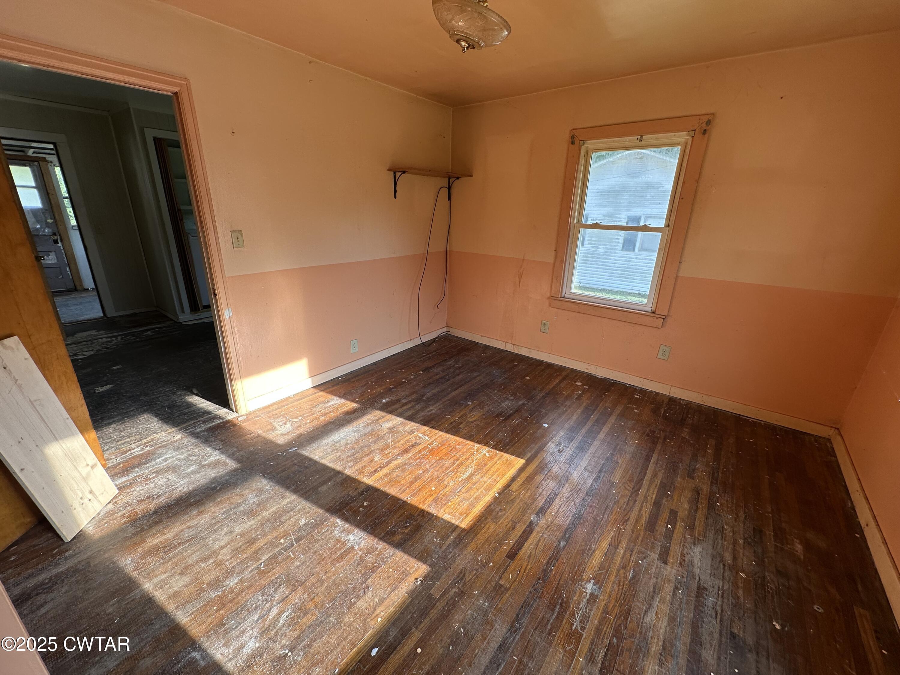 3016 Terry Street Milan, TN 38358 - Photo 13 of 16 a view of wooden floor and windows in a room