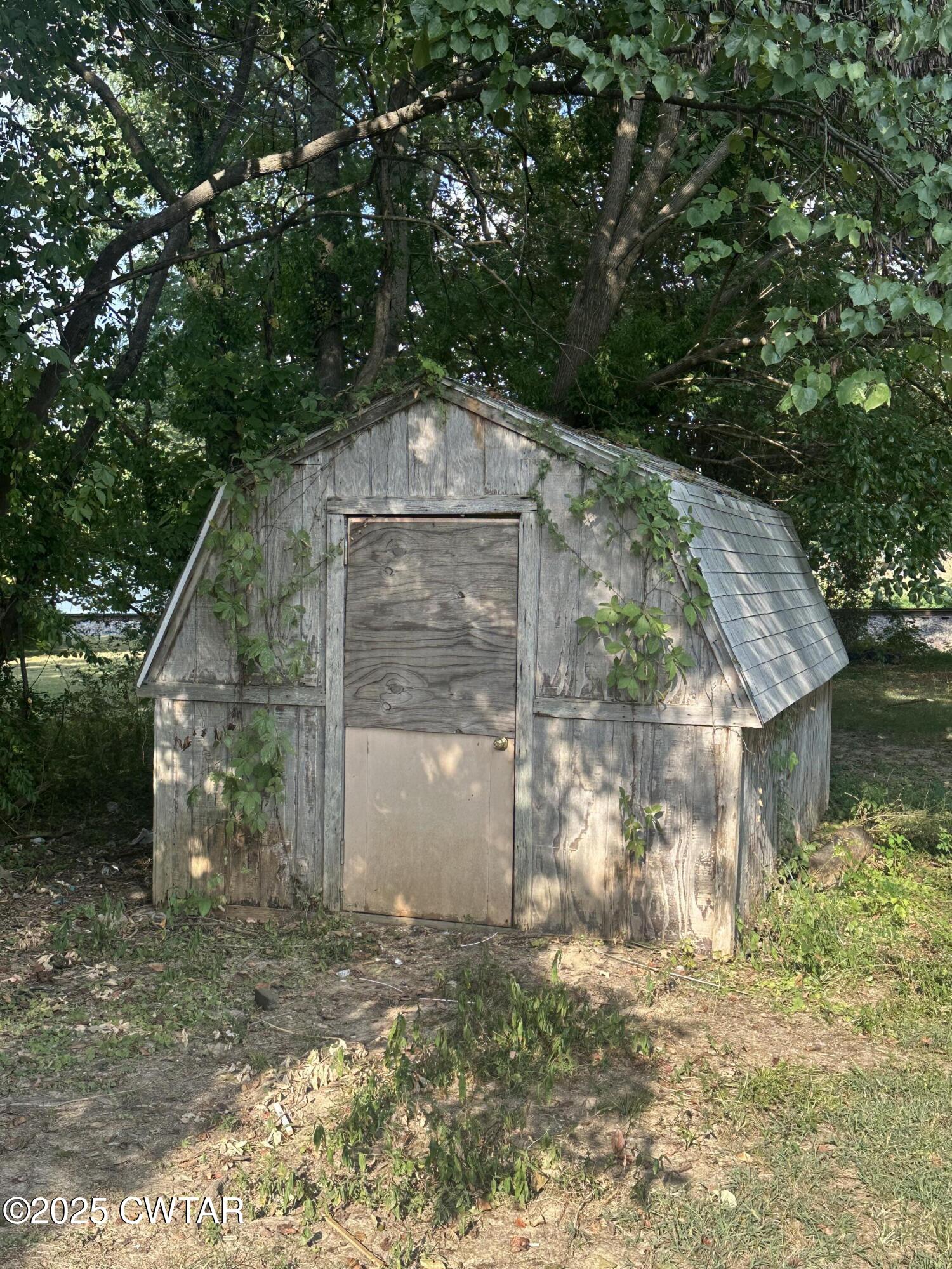 3016 Terry Street Milan, TN 38358 - Photo 16 of 16 a view of a house with a yard