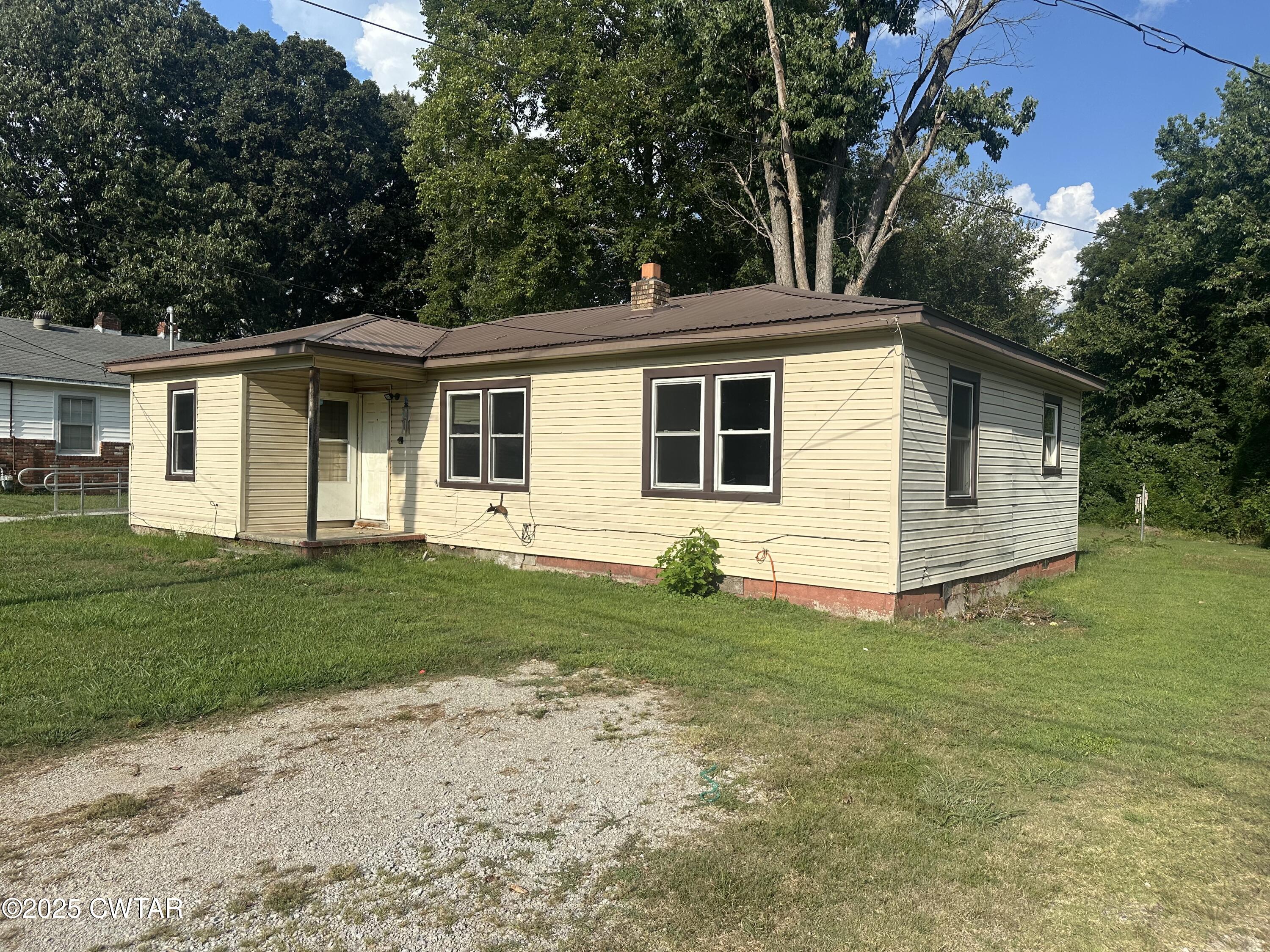 3016 Terry Street Milan, TN 38358 - Photo 2 of 16 a view of a house with a yard